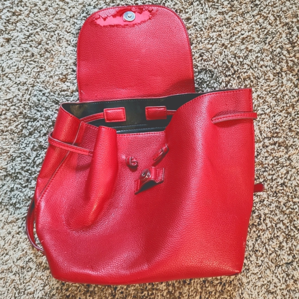 Red damaged small backpack purse